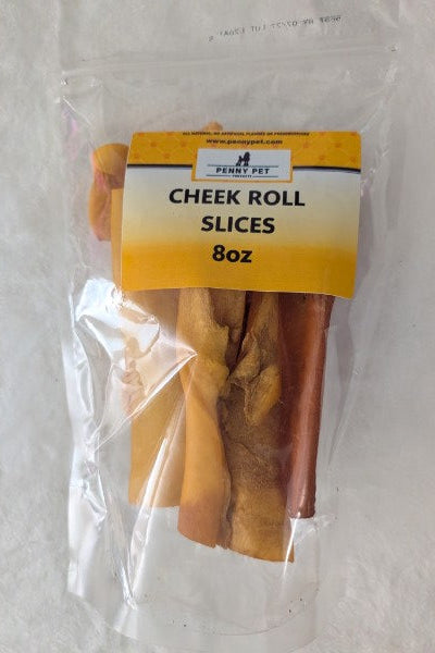 A clear plastic bag containing rolled slices of dried or cured meat, with a yellow label reading 'CHEEK ROLL SLICES 8oz'.